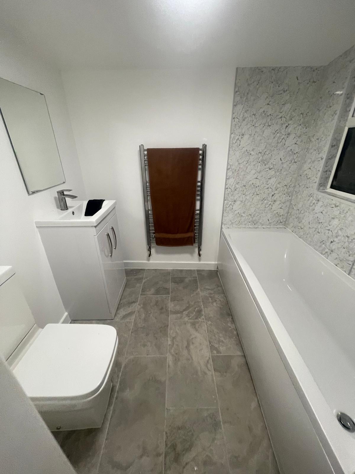 Bathroom after renovation - modern tiling, new vanity and fixtures