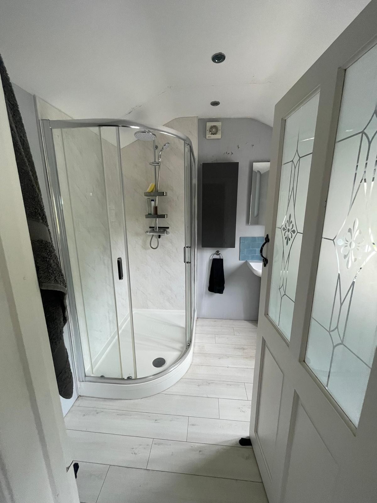 Shower room before renovation - marble effect tiles